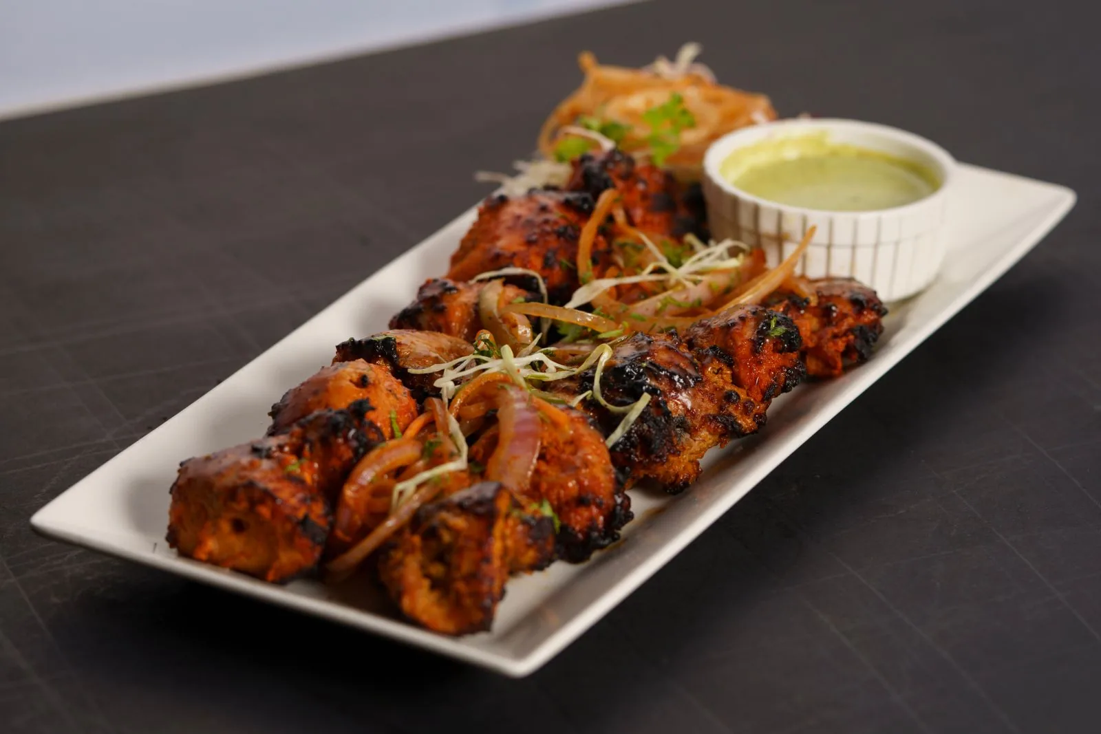 Chicken tikka platter with mint chutney for an Indian birthday party buffet (illustrative photo)