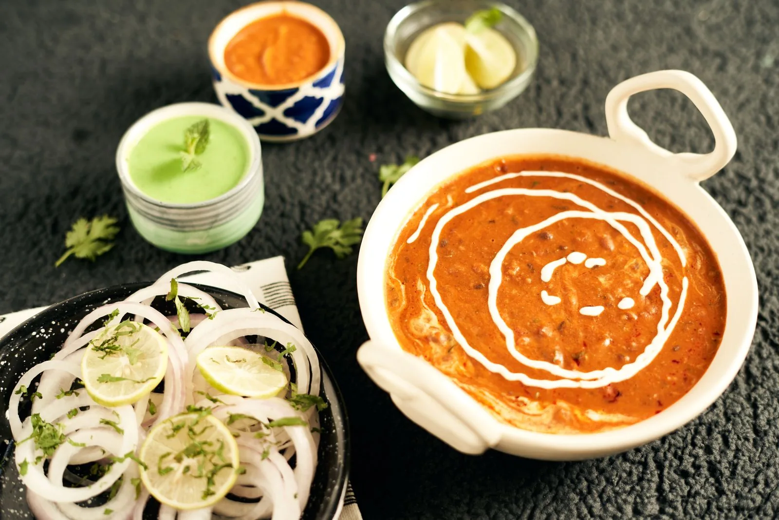 Dal makhani with chutneys and onion salad for professional Indian corporate catering (illustrative photo)